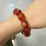 Customer wearing a bracelet featuring a Five Element inspired design