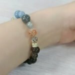 Customer wearing a crystal bracelet with personal meaning